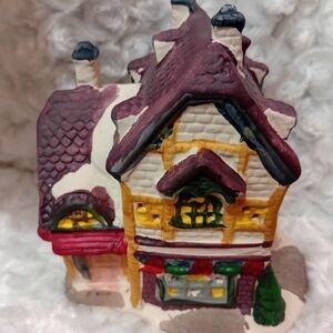 Festive Holiday Village House with Red and Green Accents